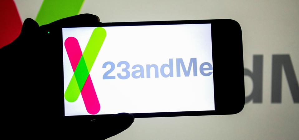 In this photo illustration, a 23andMe logo seen displayed on...