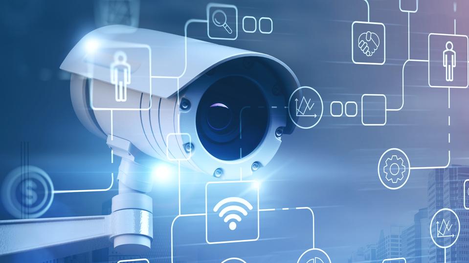 Surveillance street camera in city and icons