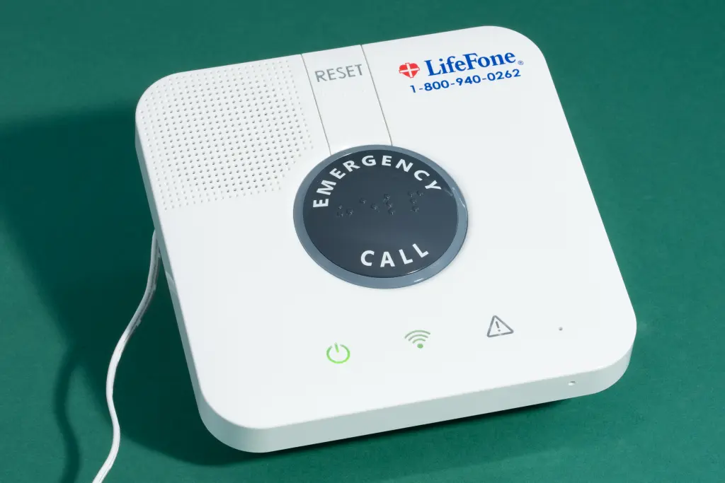 The base of the LifeFone At-Home Cellular medical alert system.