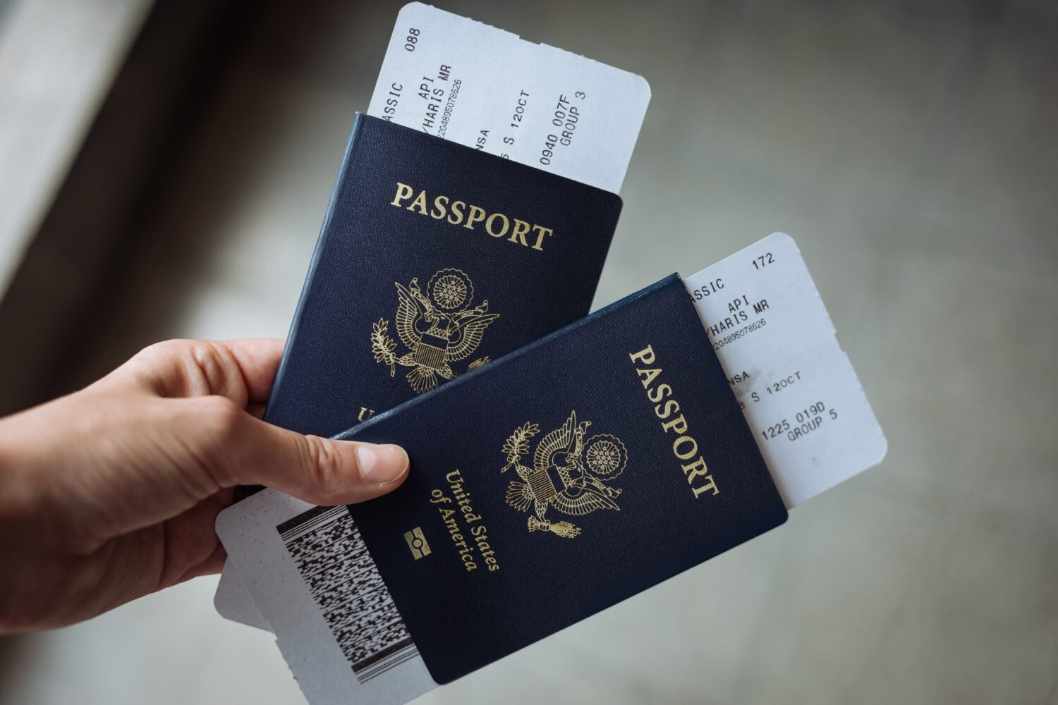 two US passports with boarding passes