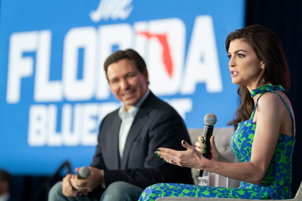 Florida Governor Ron DeSantis, left, and his wife, Casey DeSantis, speak to a crowd at the North Charleston Coliseum on April 19, 2023 in North Charleston, South Carolina.