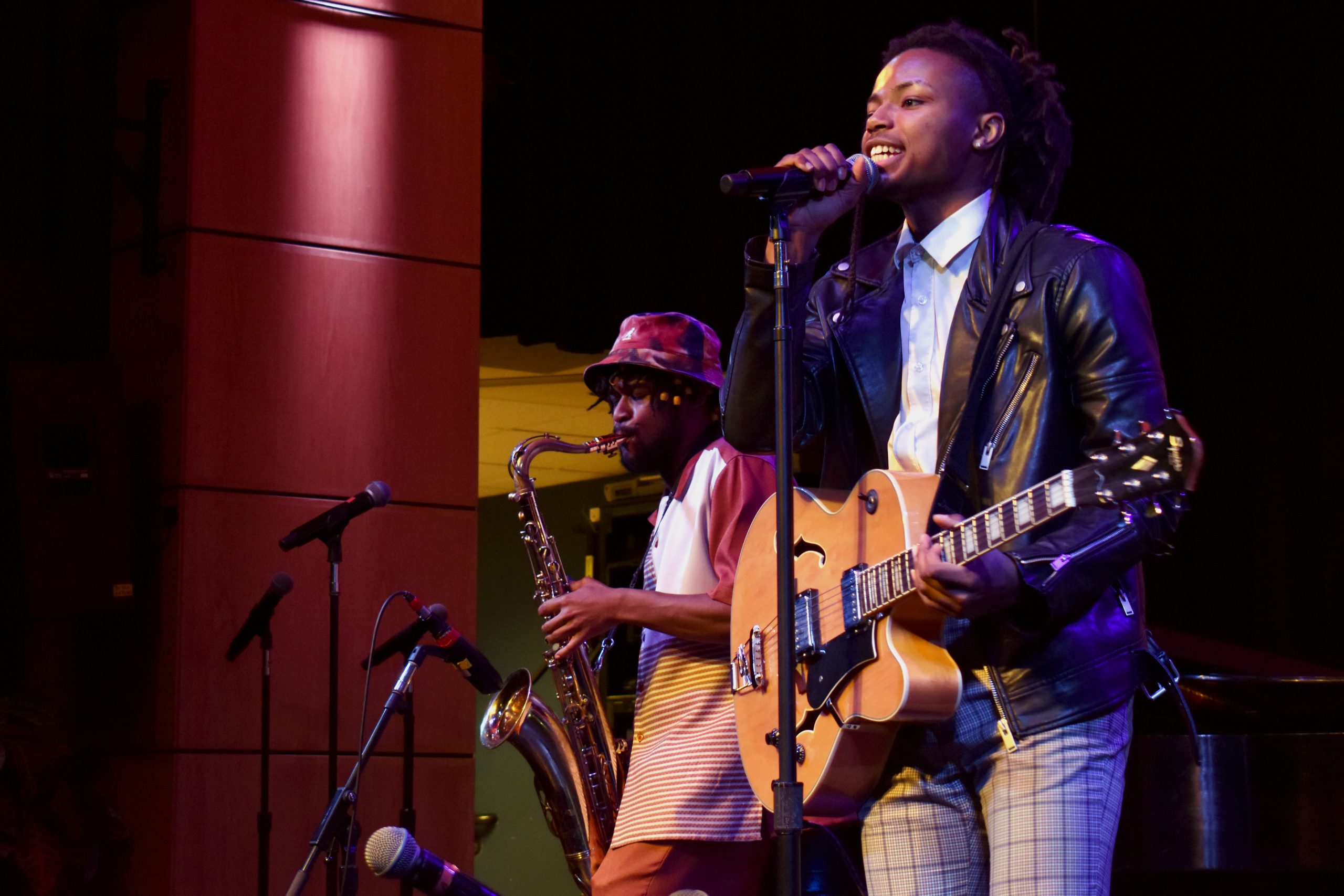 Rapper and musician K-STAMP performs with a live band at the Berklee Professional Music Department’s International Hip Hop Symposium, April 12, 2022 (photo credit: Brandon Hill).