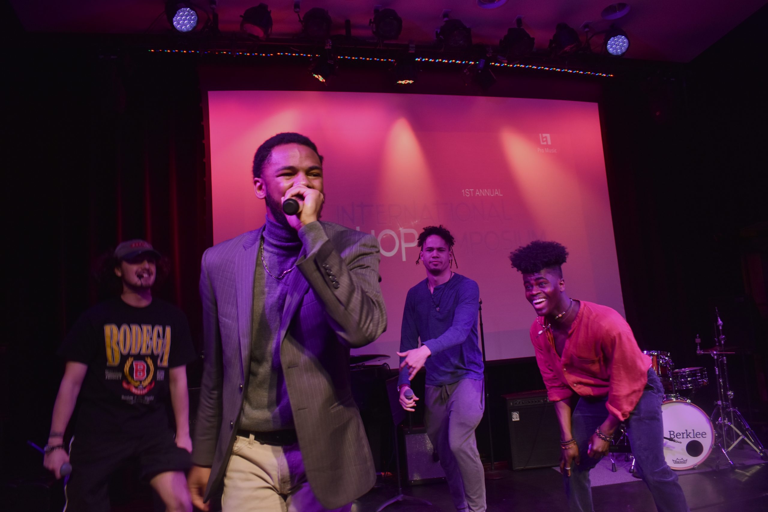 Emcee TA3 (center) ends the night performing with Aristotle Jones (left), MJangles (right) and Lil Xay (right of center) as the Berklee Cypher at the Berklee Hip Hop Symposium, April 12, 2022 (photo credit: Brandon Hill).