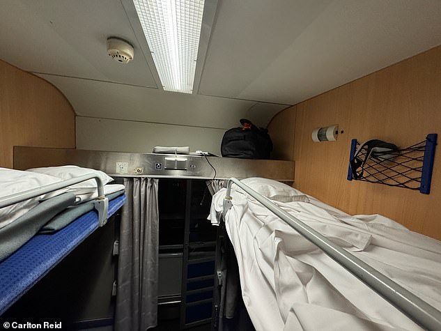 Above is Carlton's six-person Nightjet cabin, which he describes as a 'hostel on wheels'