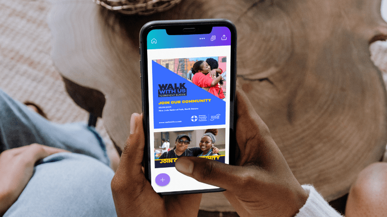 A hand holding a phone, which is open to the Canva app and displaying an example of ASPF's design work.