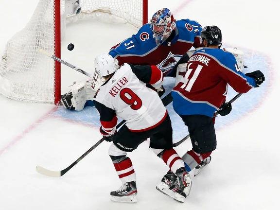 Clayton Keller of the Arizona Coyotes scores in the third period against Philipp Grubauer of the Colorado Avalanche in Game 5 of their Western Conference first-round series during the NHL Stanley Cup playoffs at Rogers Place on Aug. 19 in Edmonton.
