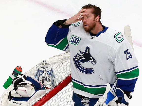 Jacob Markstrom of the Vancouver Canucks pauses following giving up a goal to Brayden Schenn of the St. Louis Blues at 15:41 of the first period in Game Five of the Western Conference First Round during the 2020 NHL Stanley Cup Playoffs at Rogers Place on August 19, 2020 in Edmonton.