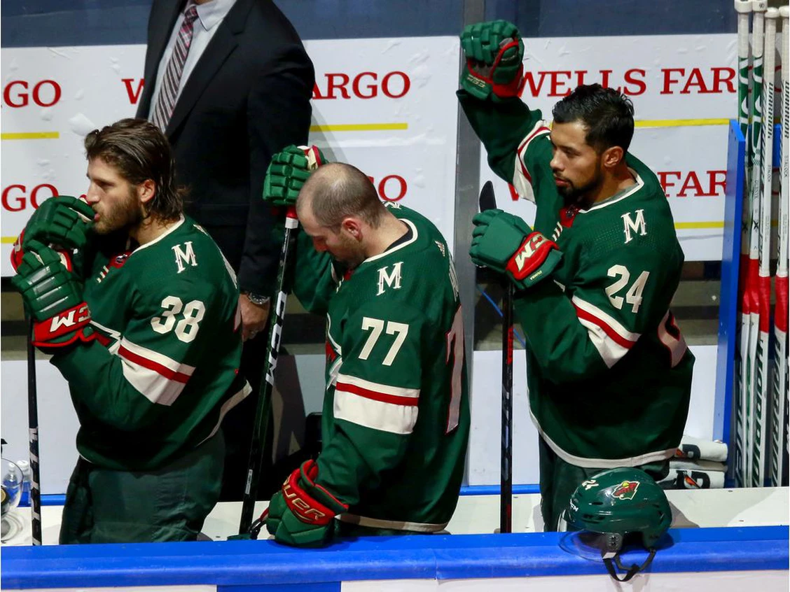 Matt Dumba of the Minnesota Wild raises his fist during the national anthem before facing the Vancouver Canucks in their Aug. 7 qualification round game at Rogers Place in Edmonton. Photo by Jeff Vinnick /Getty Images Files