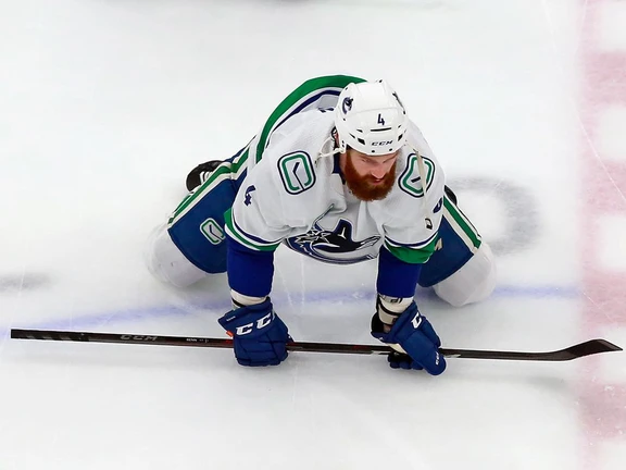 Jordie Benn of the Vancouver Canucks stretches in warm-ups prior to Game Five of the Western Conference First Round during the 2020 NHL Stanley Cup Playoffs at Rogers Place on August 19, 2020 in Edmonton.