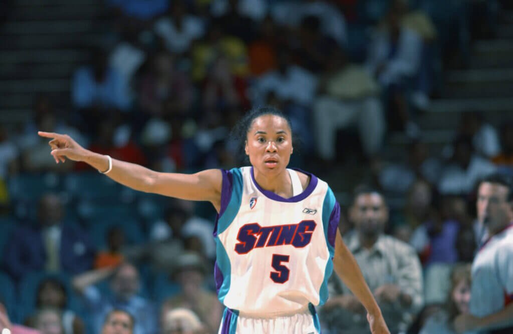 CHARLOTTE, NC - JUNE 3: Dawn Staley #5 of the Charlotte Sting directs the defense against the Houston Comets during the game on June 3, 2002 at Charlotte Coliseum in Charlotte, North Carolina. The Sting won 67-52. NOTE TO USER: User expressly acknowledges and agrees that, by downloading and/or using this Photograph, User is consenting to the terms and conditions of the Getty Images License Agreement. Mandatory copyright notice: Copyright 2002 WNBAE (Photo by: Garrett Ellwood/WNBAE/Getty Images)