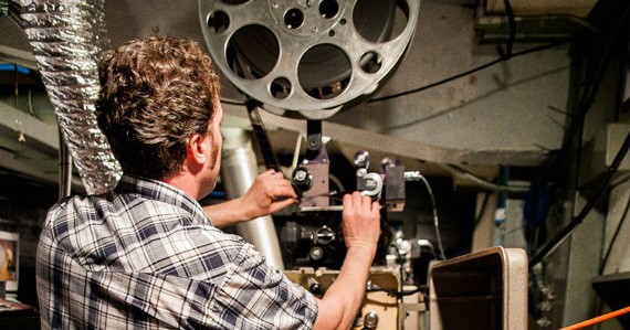 Dan Halsted readies one of the Hollywood Theatre's
Norelco AA11 projectors. Photo: Kylie Antolini