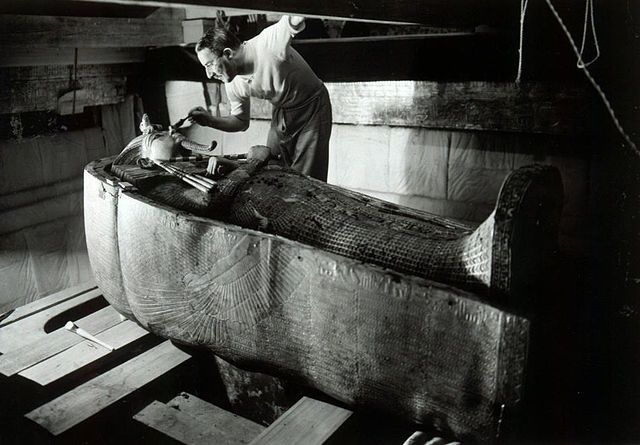 Howard Carter inspect Tut's sarcophagus