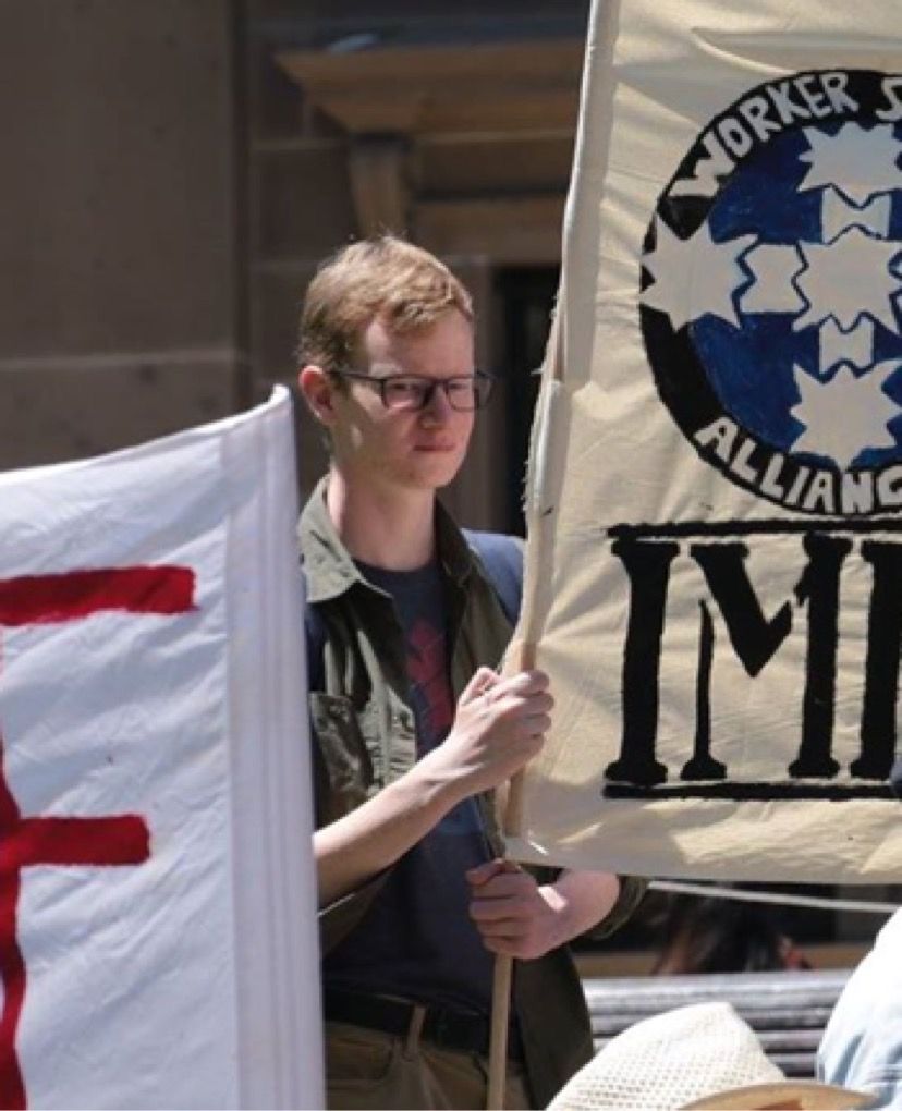 Photo of Matt Harper, Juris Doctor student from the University of Melbourne at a protest. Photo: Matt Harper