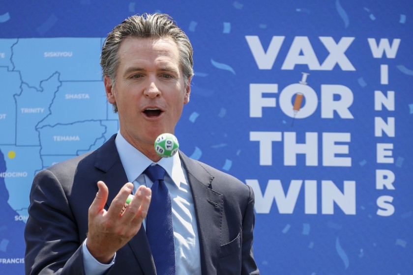 Gov. Gavin Newsom juggles numbered balls following the conclusion of a press conference at Universal Studios