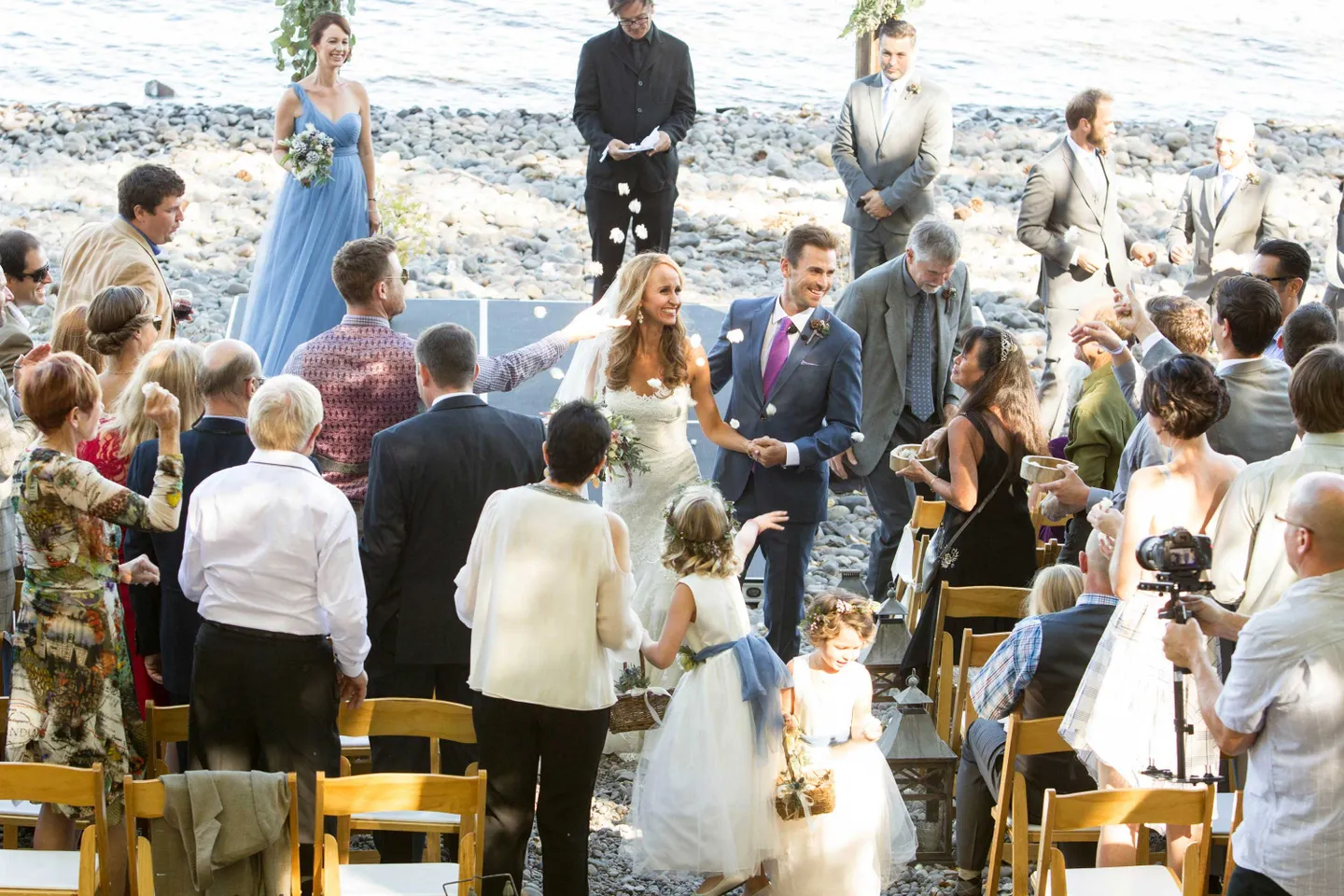 flower-girls-toss-petals-at-bride-in-pronovias-and-groom-during-recessional