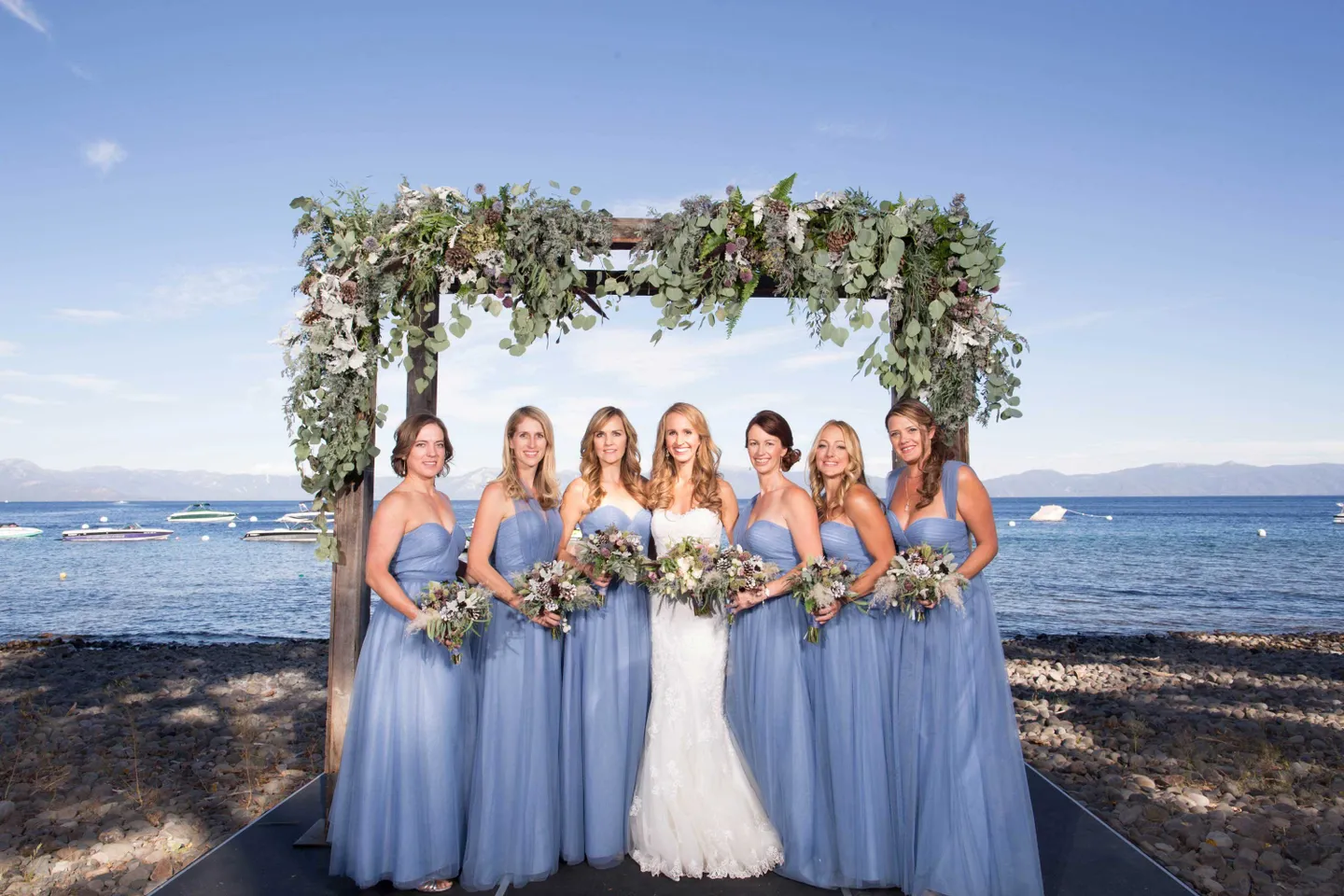 bridesmaids-blue-loose-baby-blue-sweetheart-neckline-lake-tahoe-vines-on-arch-matching-bouquets