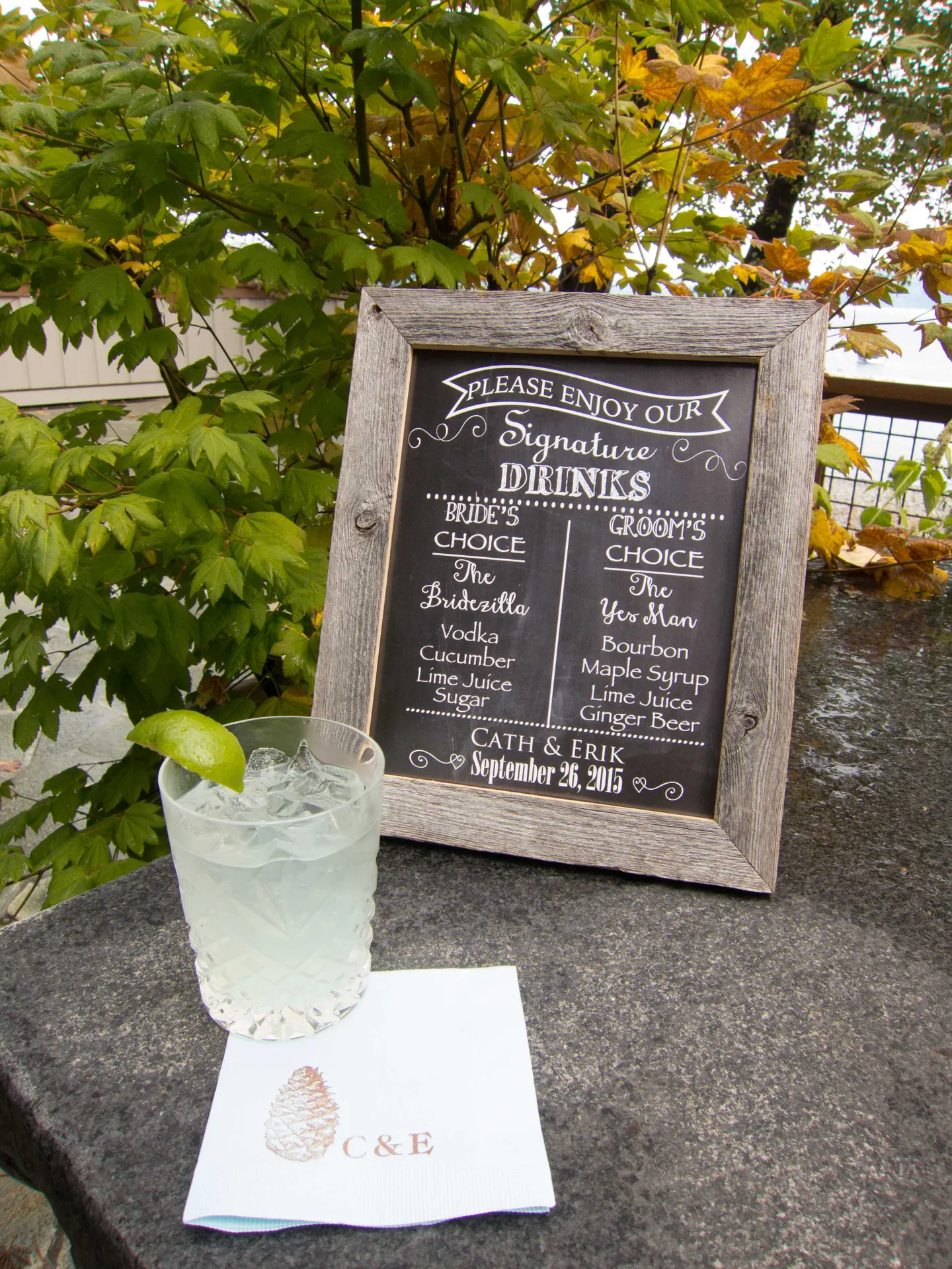 rustic-wood-framed-signature-cocktail-menu-cocktail-napkin-with-initials-and-pinecone