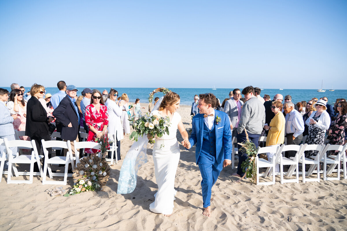 www.santabarbarawedding.com | Peterson Design & Photography | Bride and Groom Leaving Their Beach Ceremony