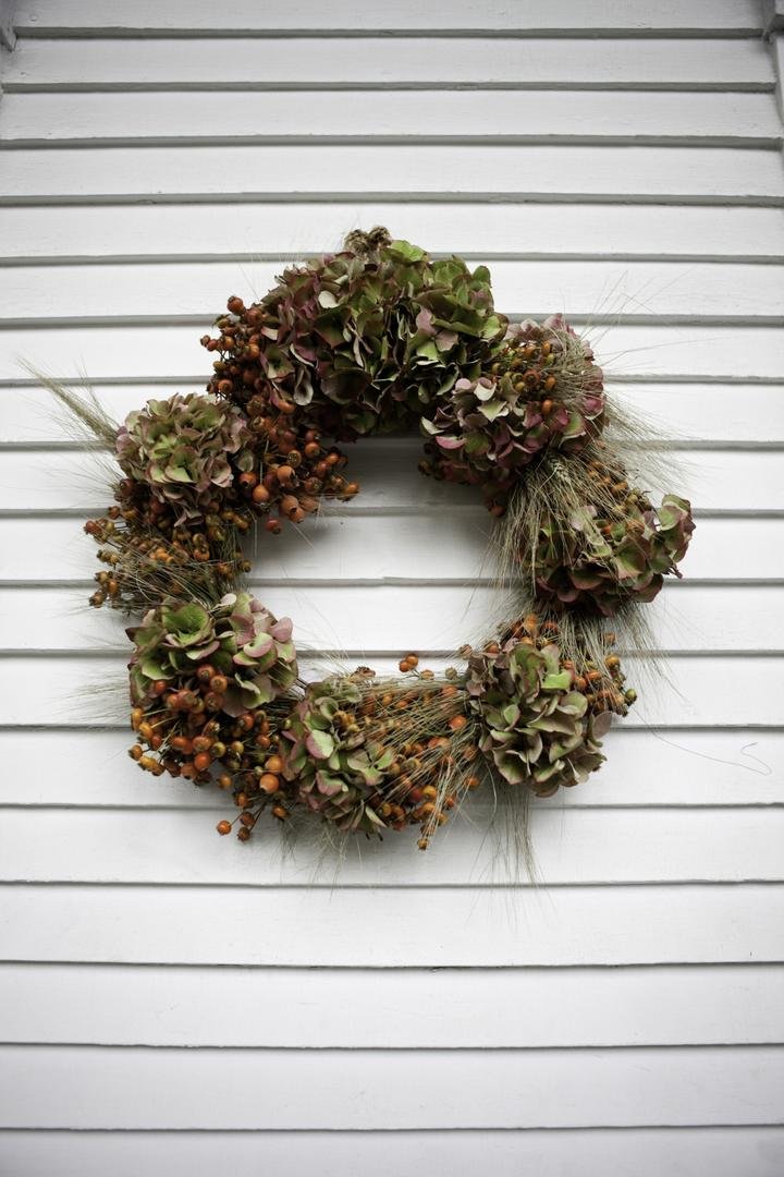 brown-and-green-circular-arrangement-on-wood