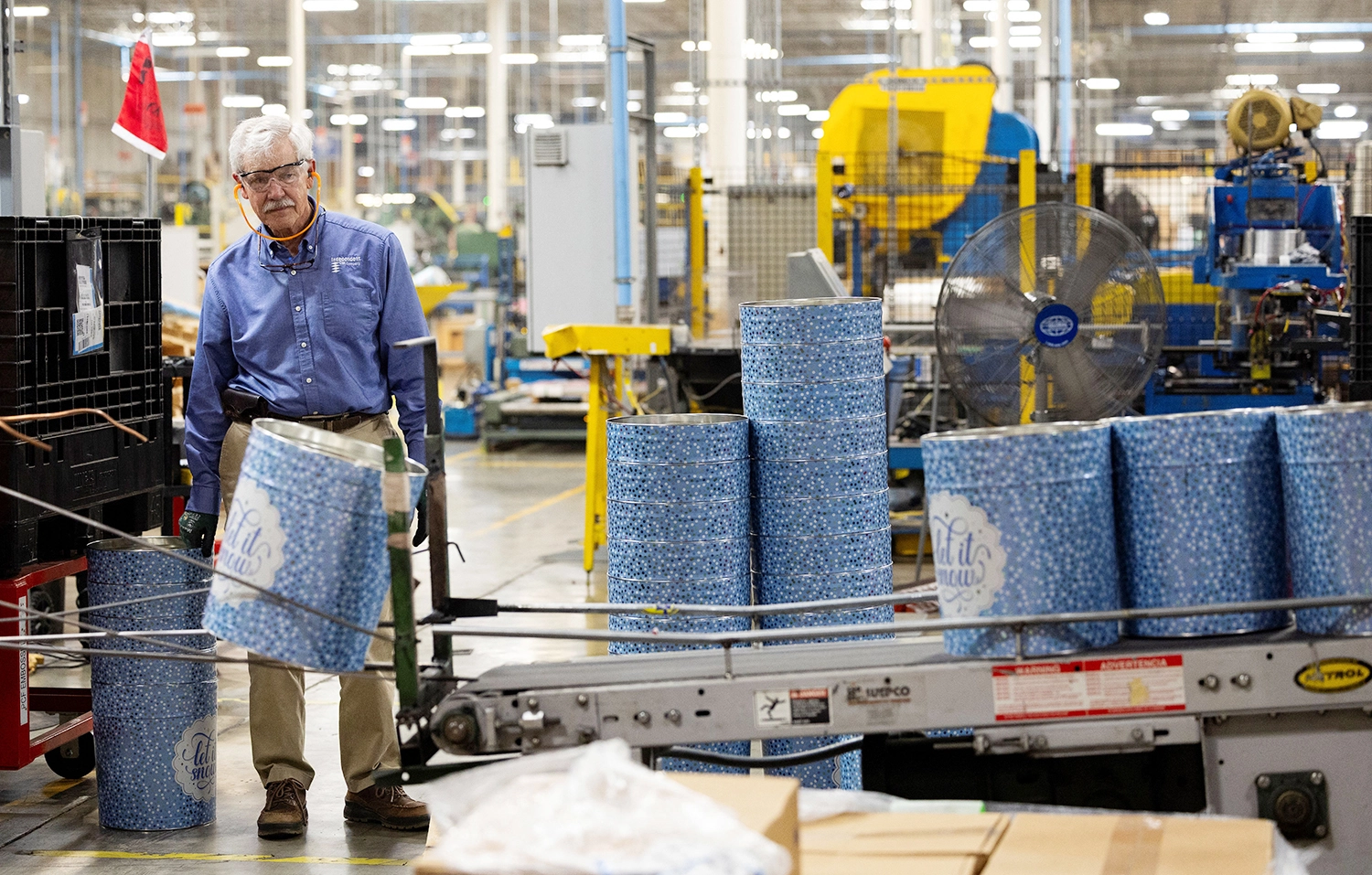 Man inspecting metal containers in manufacturing facility in Belcamp, Maryland, on June 25, 2025.