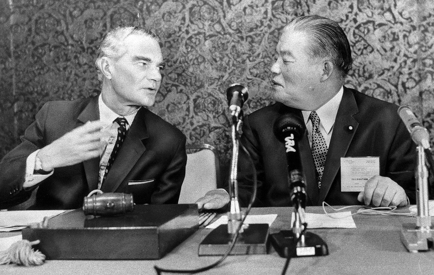 Two men speaking at GATT Tokyo meeting in Tokyo, Japan, on September 14, 1973.