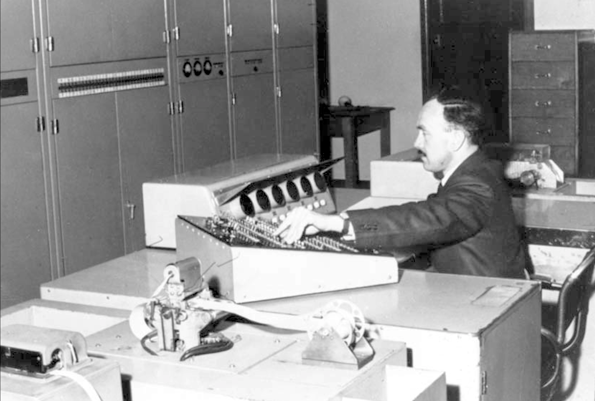 Computer engineer Jurij Semkiw at the CSIRAC console in early 1960s [Museums Victoria]
