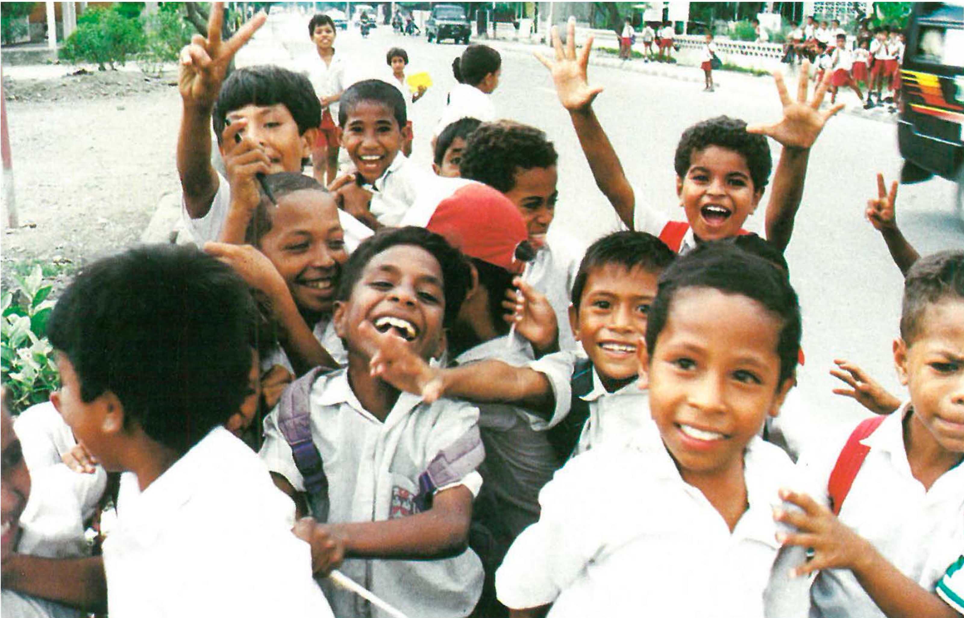 A crowd of children spontaneously break into a gleeful chant: “Viva Timor Leste! Viva Timor Leste!” (Wilson da Silva)