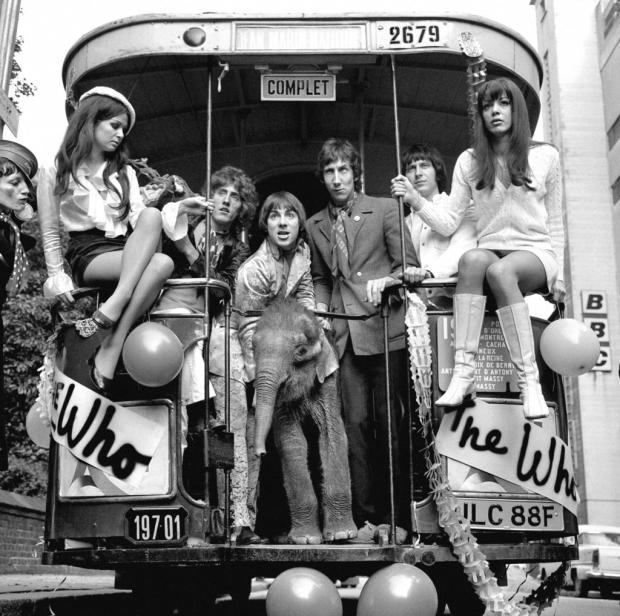 Islington Gazette: The Who in 1968, pictured on the Magic Bus from the BBC's Lime Grove studios with Eli the baby elephant and Nicola Austine (left) and Toni Lee. Picture: PA Archive/PA Images