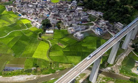 Beijing, China. 22nd June, 2016. Aerial photo taken on June 22, 2016 shows a bullet train running on the Kaili section of Shanghai-Kunming high-speed railway in southwest China’s Guizhou Province.