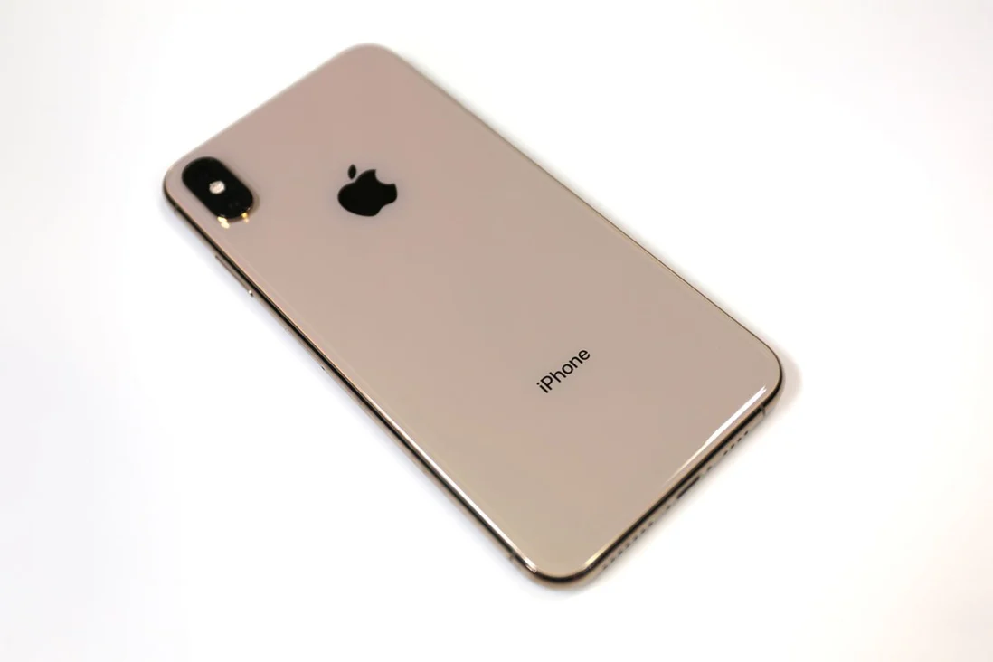 Brownish? Pinkish? Light brown with a touch of pink? Whatever you call this color, that's what the back of the gold iPhone looks like.