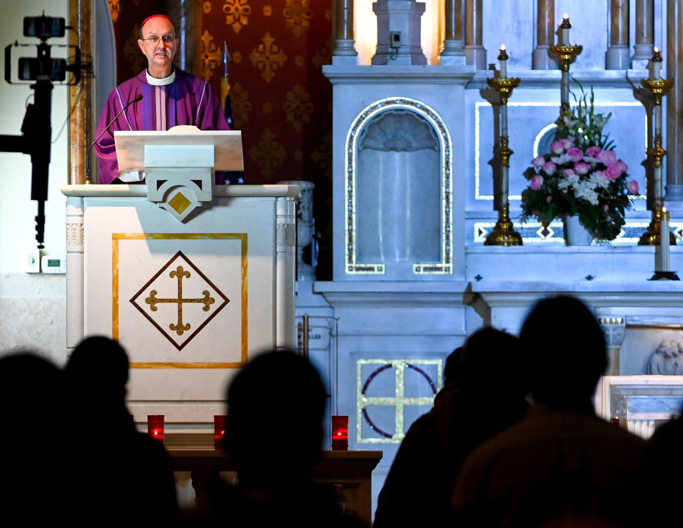 Bishop Bruce Lewandowski gives a sermon to his parish. Sacred Heart of Jesus Church in Highlandtown holds an All Souls Day Mass, honoring the members of its parish who have died in 2020.